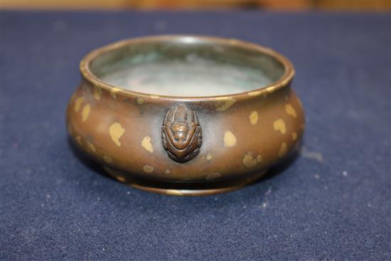 A 17th/18th century Chinese gold splashed bronze censer, Xuande mark, 19th century wood cover, jade finial H.8cm